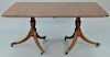Custom mahogany two part drop leaf pedestal dining table with two 18 inch leaves and gadrooned edge. ht. 29in., top: 66" x 45