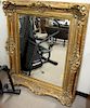 Large gold framed mirror with beveled mirror. total size 55" x 45"