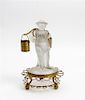 * A Molded Glass and Gilt Metal Figural Stand Height overall 9 1/2 inches.