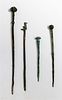 * A Group of Four Ancient Bronze Hair or Cloak Pins Length of longest 6 1/2 inches.
