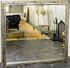 A Silvered Wood and Mirrored Glass Framed Mirror Height 39 x width 41 1/2 inches.