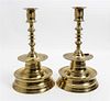 A Pair of Brass Candlesticks Height 13 1/2 inches.