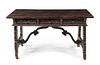* A Spanish Baroque Walnut Trestle Table and Leather Upholstered Walnut Armchair