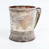 An American Silver Children's Mug, Gorham Mfg. Co., Providence, RI, 1882, of tapering, cylindrical form with a C-scroll handl