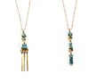 Two Navajo 14 Karat Yellow Gold and Spiderweb Turquoise Necklaces, Whirling Wind Length of each pendant 2 1/2 inches.