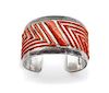 A Navajo Silver, Brass and Coral Cuff, Rita and Jimmy King Length 6 1/2 plus 1 x width 1 1/3 inches.
