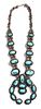A Monumental Navajo Silver and Turquoise Squash Blossom Necklace Length 29 inches; naja 5 1/4 x 5 inches.