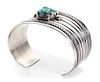 A Navajo Silver and Turquoise Cuff Bracelet, Ambrose Lincoln (1917-1989) Length 5 1/2 x opening 1 1/4 x width1 3/8 inches.
