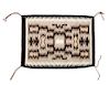 Two Navajo Rugs Larger: 27 x 36 inches.