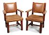 A Pair of Molesworth Style Wood and Leather Arms Chairs Height 35 x length 24 x depth 24 1/2 inches.