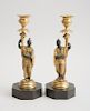 PAIR OF LATE REGENCY BRONZE AND PARCEL-GILT CHINOISERIE FIGURAL CANDLESTICKS