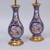 PAIR OF CHINESE EXPORT PORCELAIN FAMILLE ROSE VASES, IN THE 'MANDARIN' PATTERN, MOUNTED AS LAMPS