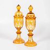 Pair of Bohemian Golden Amber Cut-to-Clear Urns 