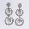 Contemporary Approx. 12.20 Carat Pave Set Round Brilliant Cut Diamond and 18 Karat White Gold Pendant Earrings.