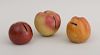 GROUP OF THREE AMERICAN REDWARE APPLE-FORM BANKS