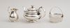 GEORGE II SILVER TEAPOT, A VICTORIAN CRESTED SILVER PEAR-FORM FOOTED CREAMER AND A SILVER MOUNTED FROSTED GLASS ICE BUCKET