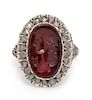 * A Victorian Silver Topped Yellow Gold, Carnelian Intaglio and Diamond Locket Ring, 4.30 dwts.