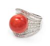 An 18 Karat White Gold, Coral and Diamond Ring, 15.30 dwts.