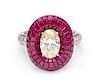 A Platinum, 18 Karat Yellow Gold, Diamond and Invisibly Set Ruby Ring, 7.90 dwts.