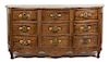 A Louis XV Provincial Style Carved Walnut Nine Drawer Serpentine Commode