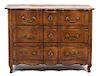 A Louis XV Provincial Style Carved Walnut Three Drawer Commode Height 36 x width 49 x depth 23 1/2 inches.
