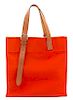 An Hermes Orange Canvas Etiviere Shopping Tote, 16" x 17" x 6"; Strap adjustable to 17".