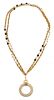 A Chanel Goldtone Double Strand Monocle Necklace, 35"; Monocle: 2" diameter.