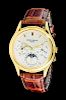 * An 18 Karat Yellow Gold Ref. 3940 Perpetual Calendar Moonphase Wristwatch, Patek Philippe,