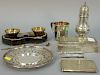 Silver lot including castor, box, cigarette case, strawberry plate, cup, and pair of salts and spoons in fitted box. 28.5 t o