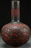 A CHINESE TWO COLOR CARVED CINNABAR BOTTLE VASE