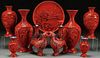 A NINE PIECE GROUP OF CHINESE CARVED CINNABAR RED