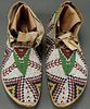 PAIR OF SIOUX BEADED MEN’S MOCCASINS, CIRCA 1900