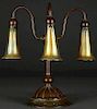 A TIFFANY BRONZE THREE LILY LAMP, EARLY 20TH C