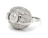 An Art Deco Platinum and Diamond Bombe Ring, 6.20 dwts.