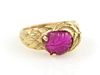 An 18 Karat Yellow Gold and Carved Ruby Ring, Circa 1945, 5.10 dwts.