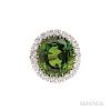 Fine Platinum, Peridot, and Diamond Ring, Suna Brothers, the round faceted peridot weighing 39.55 dwt, framed by twenty full-