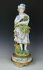 19C French porcelain figurine "Girl with Flowers and Eggs"