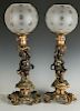 A PAIR 19TH C. FRENCH BRONZE PUTTO FIGURAL LAMPS