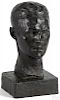 Patinated bronze head of a young man