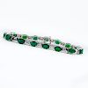 Approx. 12.48 Carat Oval Cut Emerald, 1.80 Carat Baguette Cut Diamond and 14 Karat White Gold Bracelet.