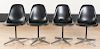 Four Eames office chairs