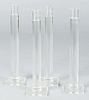 Set of four Shea glass candlesticks