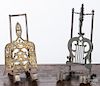 Two iron and brass hanging kettle stands.