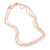 A Three Strand Angel Skin Coral Bead Necklace