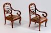 PAIR OF BALTIC NEOCLASSICAL STYLE MAHOGANY, EBONIZED AND PARCEL-GILT ARMCHAIRS