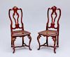 PAIR OF ITALIAN ROCOCO RED PAINTED, PARCEL-GILT AND CANED SIDE CHAIRS