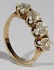 14 karat gold ring set with four diamonds each approximately