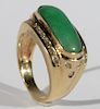 14 karat gold ring set with long oval green jade surrounded by diamonds. size 8