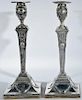 Pair of English silver candlesticks on square bases having wood bases. ht. 12 3/4in.