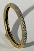 18 karat gold bangle bracelet set with approximately eighty diamonds